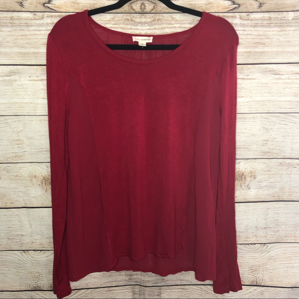 Red long sleeve top with sheer back